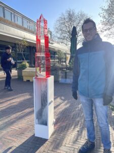 Geert outside next to a stylized version of the Utrecht Dom Tower, symbol of the City of Utrecht. 